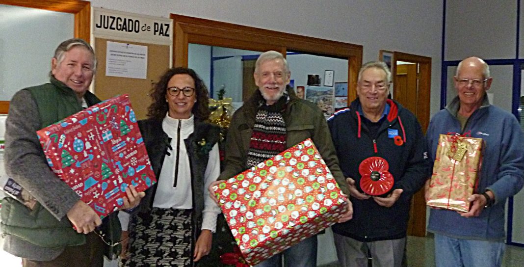 members of the Branch together with the local Social Worker Doña Librada Mira Iñesta and just a few of the many presents